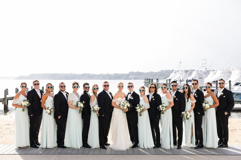 Bridal Party lined up in front of Clarks Landing marina