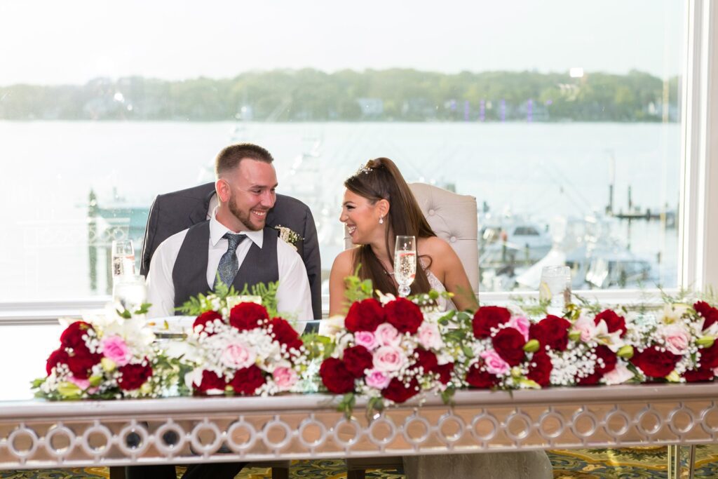 Bride and groom at sweetheart table in Clarks Landing ballroom